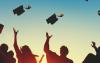high school seniors throwing graduation caps - scholarships for Midwest Electric