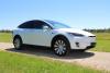 Midwest Electric member Craig Hart purchases Tesla X EV and receives rebate from Midwest Electric for charging station
