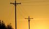 Photo of power lines in the sunset